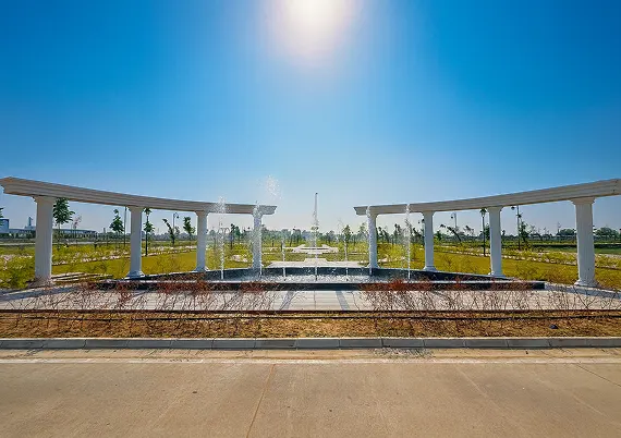 Landscaped fountain plaza with pergola in Reliance MET City Jhajjar