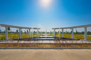 Landscaped fountain plaza with pergola in Reliance MET City Jhajjar